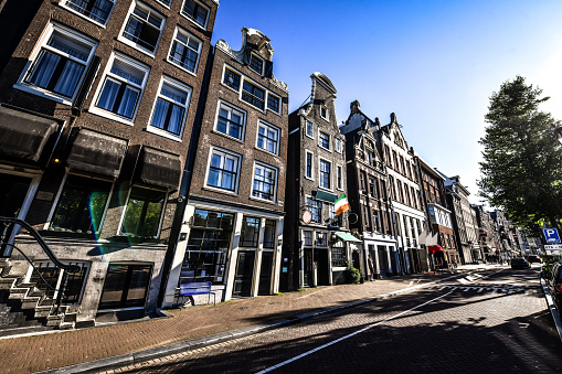 Amsterdam, Holland - May, 2018: De Waag medieval building on Nieuwmarkt square or New Market square with blue sky