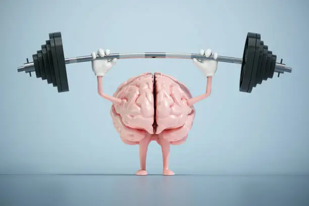 Photo of Brain lifting weights. Cognitive development concept