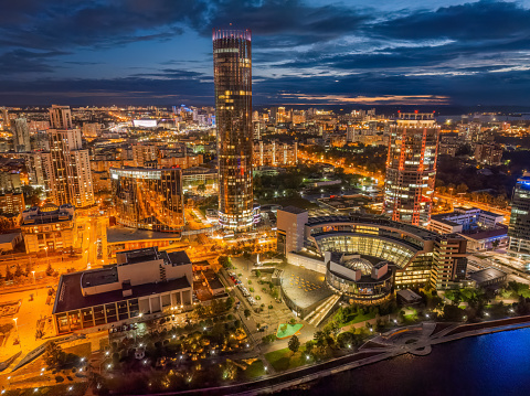 Yekaterinburg city and pond aerial panoramic view at summer or early autumn night. Night city in the early autumn. Yekaterinburg, Russia. Aerial view.
