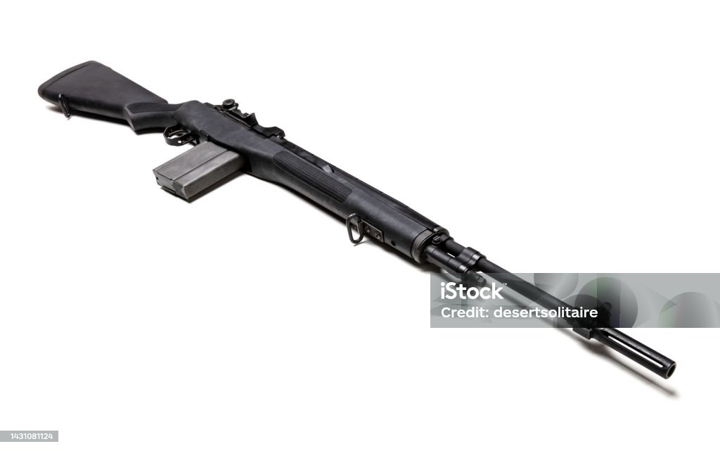 Springfield Armory M1A .303 caliber rifle Black .303 caliber M1A rifle with a high-capacity clip isolated in white. Barrel Stock Photo