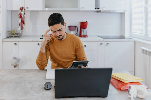 istock Confused man thinking of something 1431083229