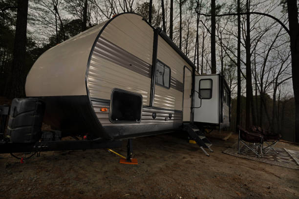 istock Travel trailer after dusk at a campsite 1431083253