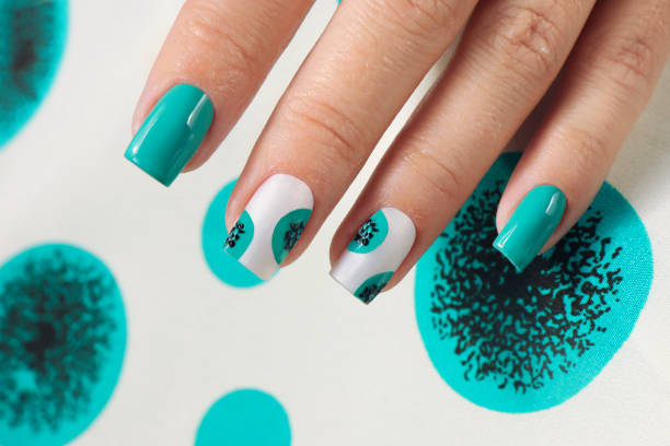 istock Nail design with light and turquoise nail polish . 1431091762