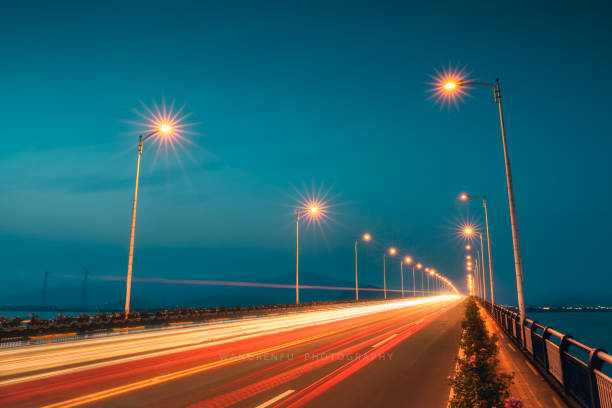 istock Tracks and street lights on the bridge at night 1431092015