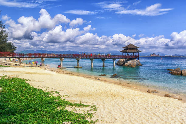 istock Red trestle bridge with blue sky and blue sea and seaside 1431092743