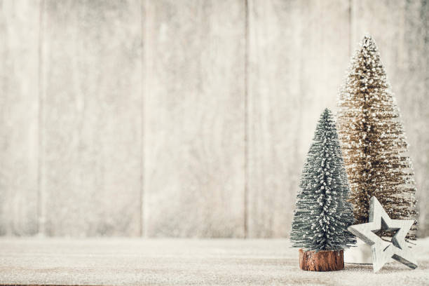 istock Artificial Christmas tree on a wooden background. 1431099532