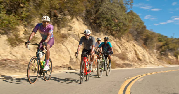 istock Group of Black Cyclists on Mountain Road 1431104114