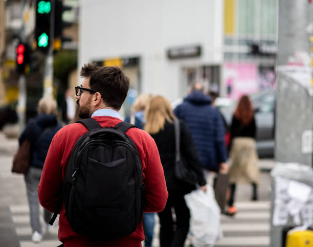 istock Young man on his way to work through the city crowd 1431104409