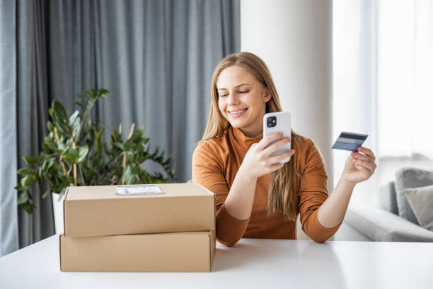 istock Young woman using smart phone to shop online 1431108000