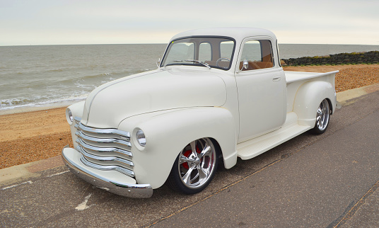 Felixstowe, Suffolk, England -  August 27, 2016: Classic Bright White Chevrolet pickup truck on Felixstowe seafront.