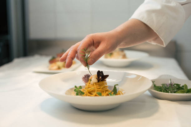 istock Chef hand preparing pasta, Italian food 1431109705