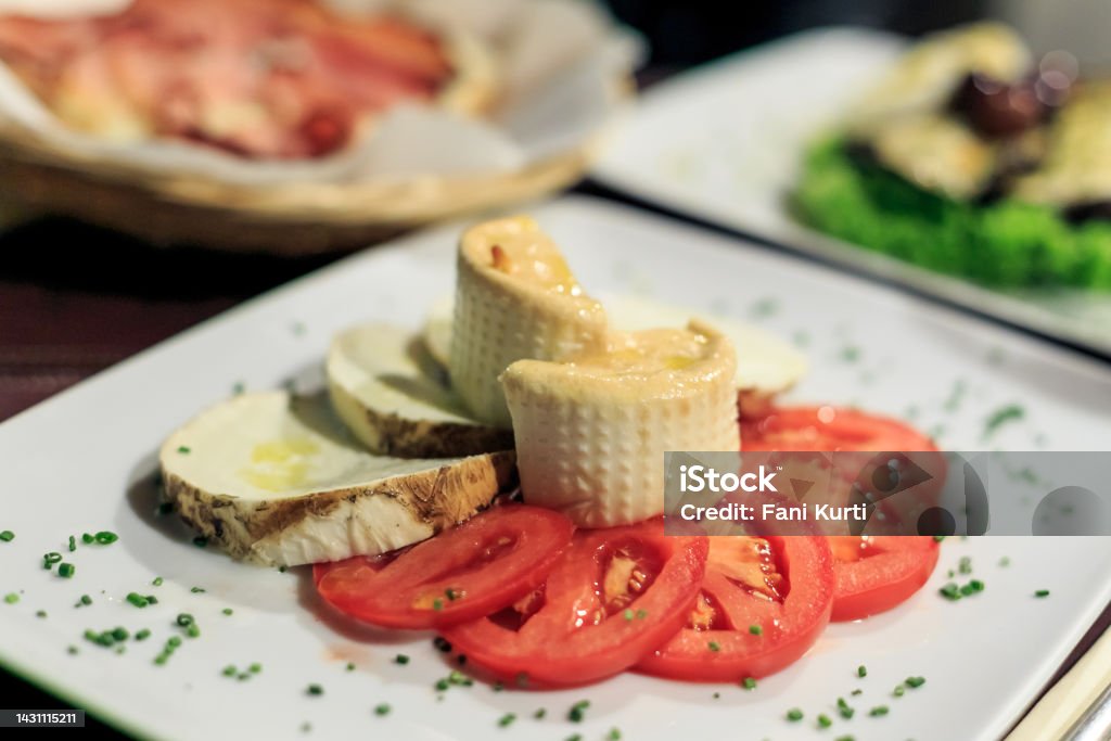 Baked cheese and tomato Italian food Italian food Restaurant Stock Photo