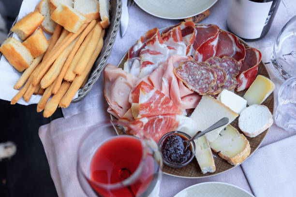 salami and cheese wooden board - italian appetizer imagens e fotografias de stock