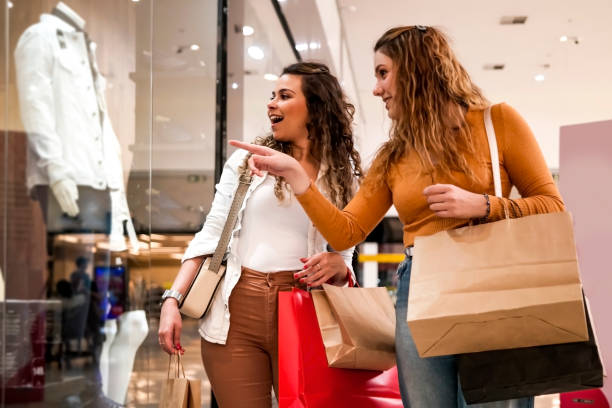 Two women making shopping. Photo of two women making shopping. the mall stock pictures, royalty-free photos & images