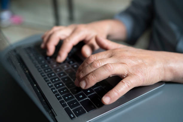 istock Detail of senior computing student typing on a laptop at a technology class 1431116717