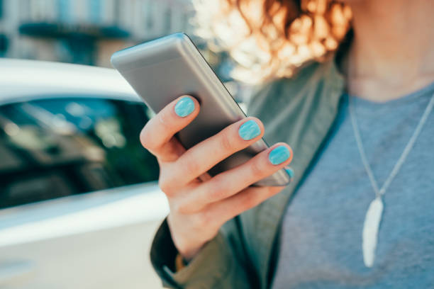istock Closeup young woman using smart phone 1431117150