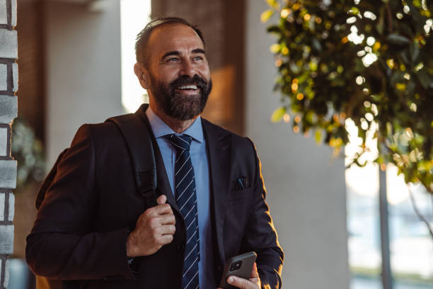 istock Confident mature businessman with smart phone 1431136572