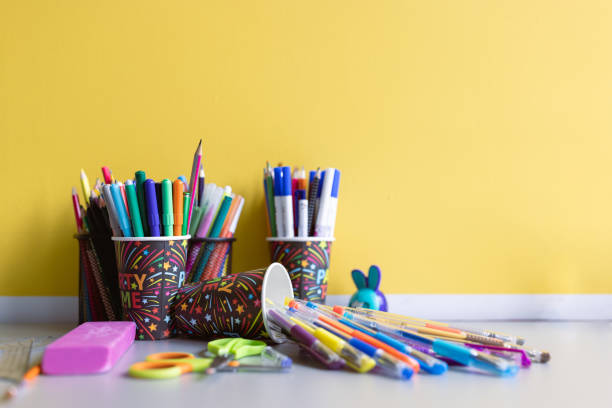 istock Color pencils on a yellow wall background 1431136672