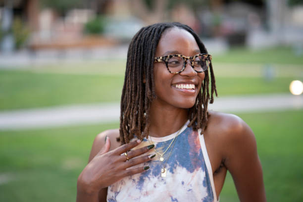 istock Smiling African American woman looking away 1431138460