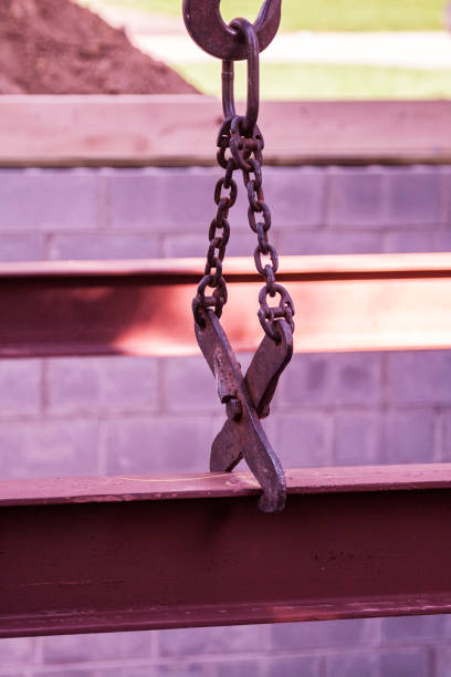 istock Construction Crane Tongs Gripping and Lowering I-Beam Girder 1431138594