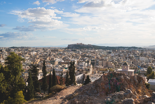 Athens, Attica, beautiful super-wide summer angle view of Athens, Greece, with Acropolis, Mount Lycabettus, mountains and scenery beyond the city, seen from Strefi Hill in Exarcheia neighbourhood