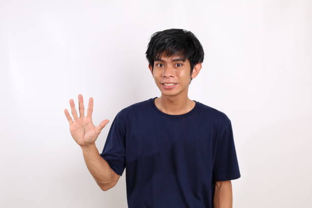 istock Happy asian young man in casual standing while showing five finger. Isolated on white with copyspace 1431150308