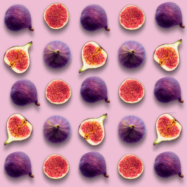 istock Fig fruits, whole and cut in half, seamless vibrant grid pattern on pink color background 1431150453