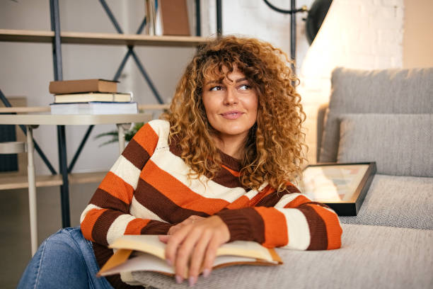 istock Woman enjoying at home and reading a book. 1431154319