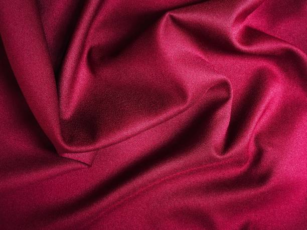 istock Fabric texture of natural cotton, wool, silk or linen textile material. Red fabric background 1431160772