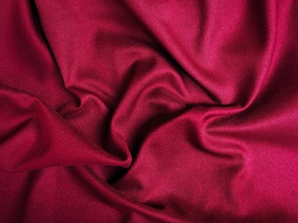 istock Fabric texture of natural cotton, wool, silk or linen textile material. Red fabric background 1431161720