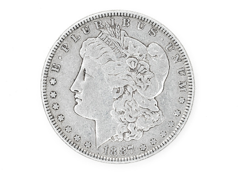 Silver coins of American currency isolated with a white background.