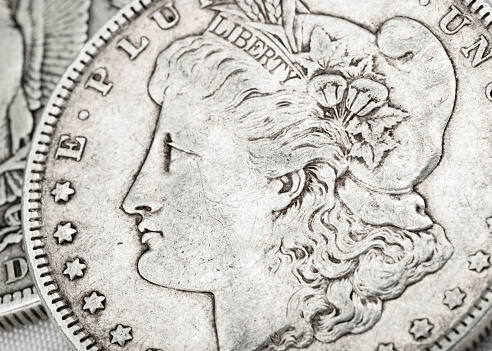 Silver coins of American currency isolated with a white background.