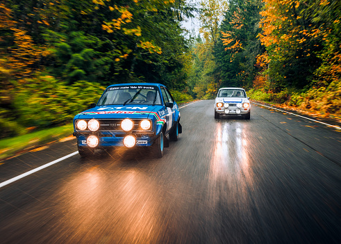 Seattle, WA, USA\n10/05/2022\nTwo Ford Escorts driving on the road together