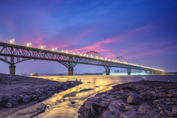 istock jiujiang yangtze river bridge at night 1431181766