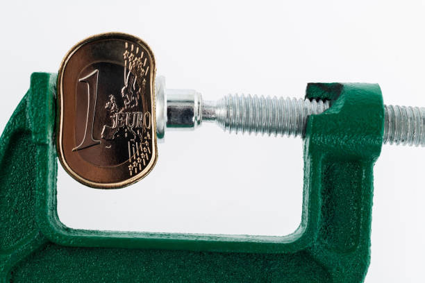istock C-clamp bending a euro coin 1431183861