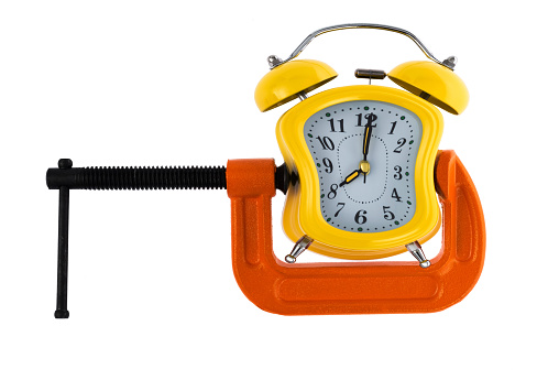 Orange clamp with a alarm clock.