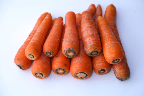 istock Bunch of Carrots on white background 1431192626