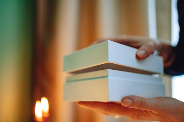 istock Unrecognizable Woman Opening Christmas Present At Home 1431196530