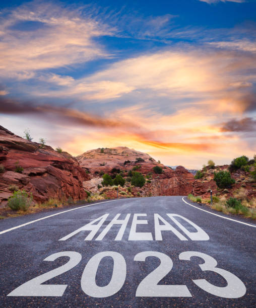 istock New Year 2023 ahead - empty road at sunrise 1431196964