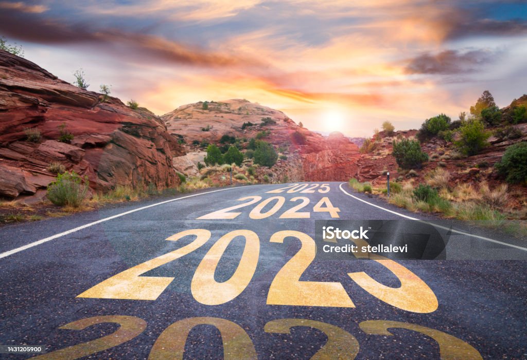 New Year 2023 road with sunrise and upcoming years ahead 2023 road with sunrise and upcoming years ahead 2025 Stock Photo