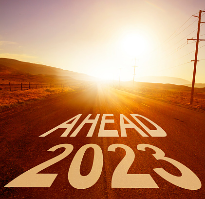 New Year 2023 ahead - empty road at sunset
