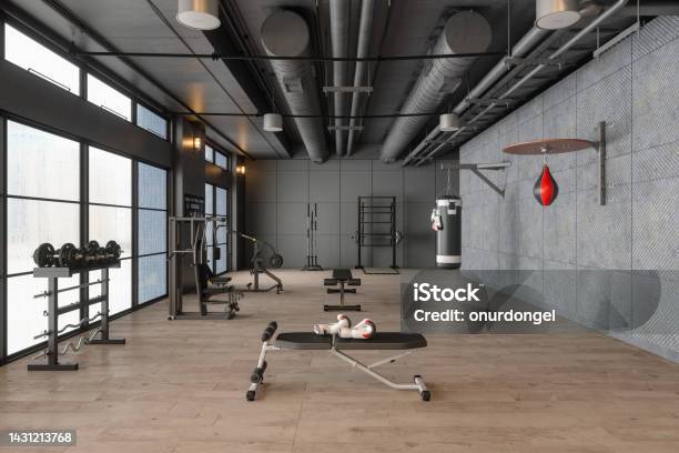 Modern Gym Interior With Boxing Bag Workout And Training Equipments Stock Photo - Download Image Now
