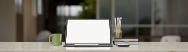 istock Close-up, Workspace with digital tablet mockup on tabletop over blurred room background 1431218565