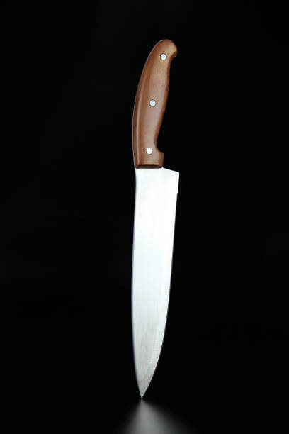 istock Knife weapon cook stainless. Chefs knife on black background. 1431223790
