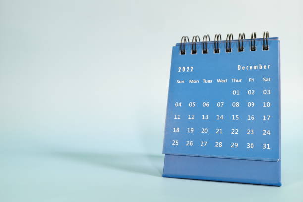 istock Selective focus of December 2022 desk calendar on blue background with copy space. 1431223826