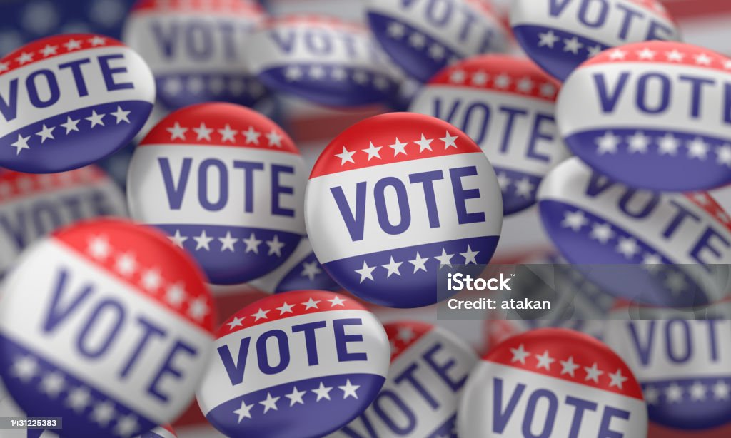 USA Flag And Vote Badge Badges with Vote writing on the American flag. Voting Stock Photo