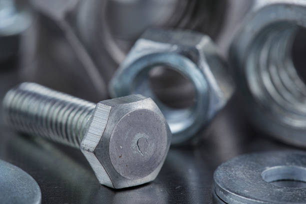 istock set of different nuts, bolts, screws, washers and drill bits,thread tap and mill cutters on steel plate background. Locksmithing deal. 1431232548