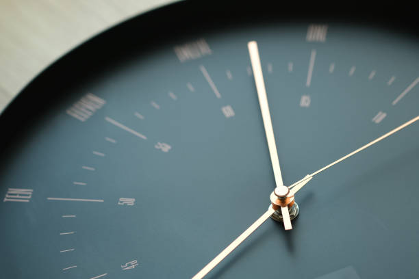 istock The black wall clock has gold hands that look elegant and modern. 1431236571