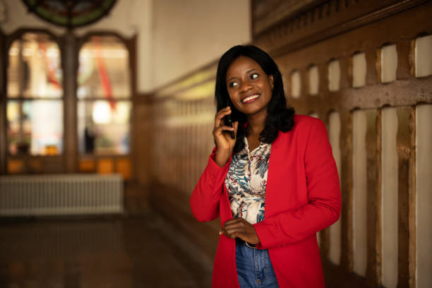 istock Beautiful businesswoman using phone outside. 1431237681