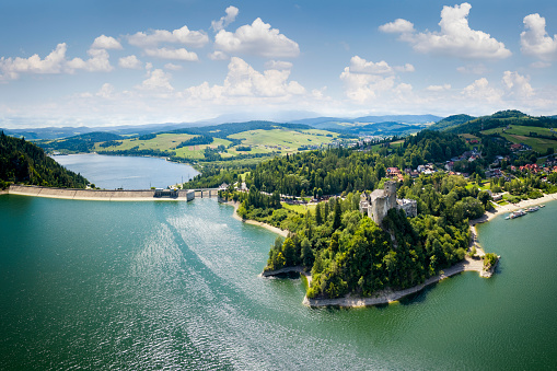 Vacations in Poland - Lake Czorsztyn with water dam and Pieniny Mountains in background